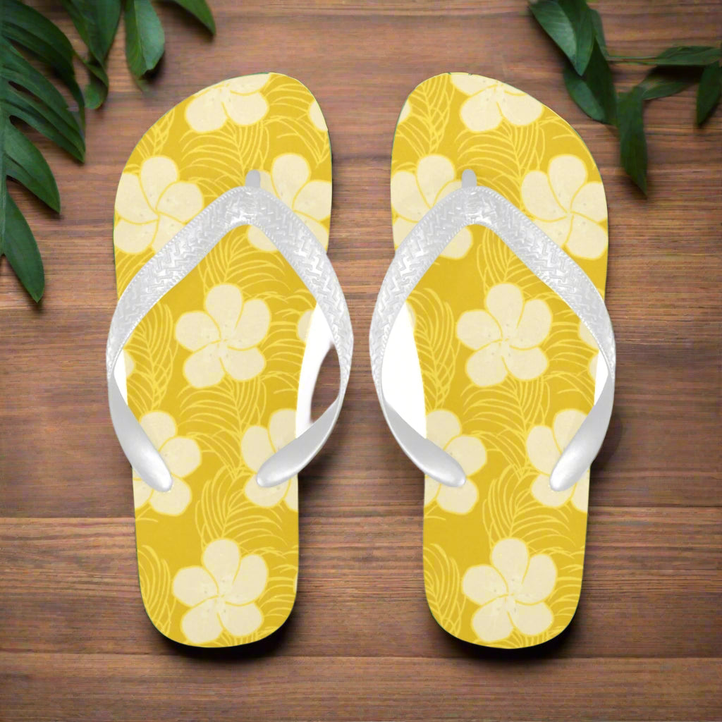 Pair of flip flops with unique hand drawn frangipani design