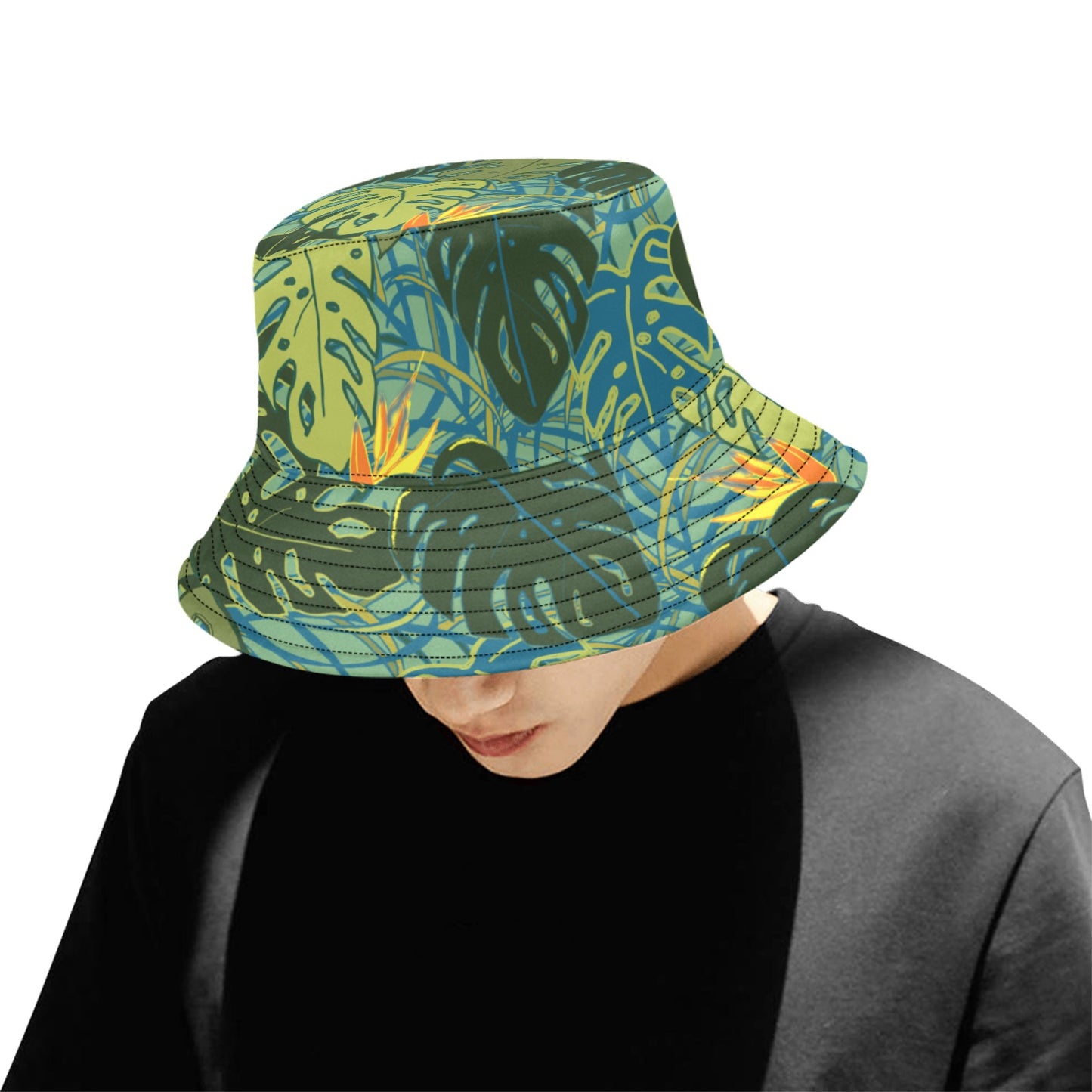model looking down wearing tropical canopy monstera leaf bucket hat