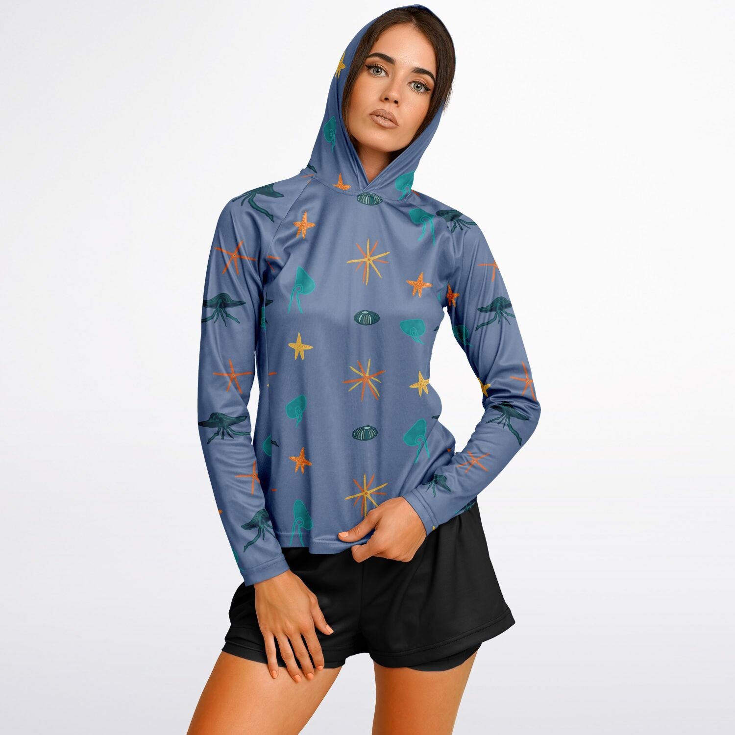 sun protection hoodie with bright and colourful jellyfish and starfish on a purple background