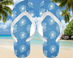 flip flops with blue crackled background with white daisies