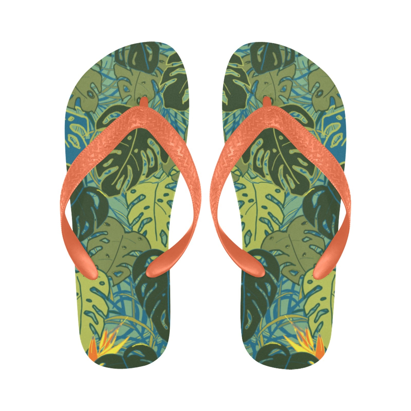 pair of flip flops with tropical canopy monstera leaves and bird of paradise flowers